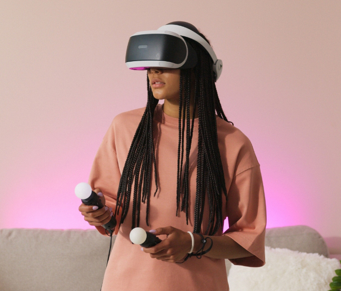 Woman using a VR headset with motion controllers